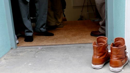 Leaving shoes at the door can signal a transition. Photo courtesy of flickr.